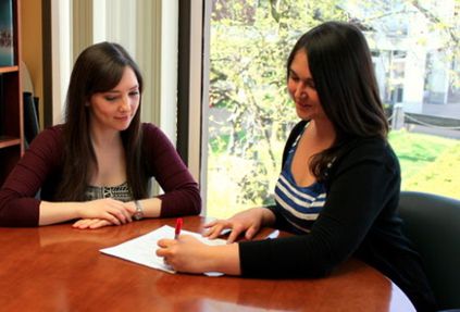 Career Services working helping female student.